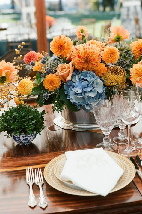 Orange is far from groundbreaking for fall, but when paired with blue—like in this floral arrangement by Amaryllis Floral and Event Design—it'll take your centerpiece to a whole new level. Country Wedding Color Schemes, Small Wedding Centerpieces, Low Wedding Centerpieces, Blue And Orange Wedding, Short Centerpieces, Blue Flower Arrangements, Fall Pinterest, Fall Wedding Color Palette, Citrus Wedding