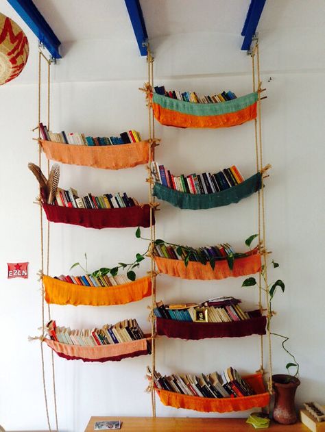 Make your own colorful bookshelves DIY. Fabric bookshelf with rope. Curtain Bookshelf Cover, Renter Friendly Book Storage, Renter Friendly Bookshelves, Diy Bookshelf Wall Small Spaces, Fabric Bookshelf, Colorful Bookshelves, Diy Bookshelf Ideas, Glass Library, Diy Bookshelves