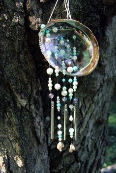 how to make a wind chime abalone shell wind chime tutorial Wind Chimes Homemade, Unique Wind Chime, Shell Wind Chimes, Diy Wind Chimes, Shell Crafts Diy, Shell Decor, Fancy Beads, Paua Shell, Art Pendant