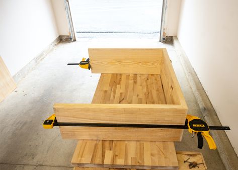 Table laying on its side with trigger clamps pressing joints together. Diy Waterfall Table Console Tables, Diy West Elm Console Table, Diy Waterfall Entry Table, Waterfall Ottoman Table Diy, Waterfall Side Table, Build A Console Table Diy, Entryway Table Diy Plans, Diy Couch Console Table, How To Build A Console Table