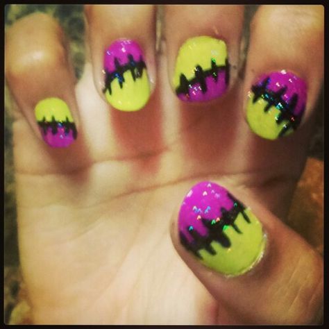 My first Halloween nail design, painted on my sweet baby girl, Jeanine. Frankenstien/stitched nail design in neon purple and lime green, added some extra sparkle with a Northern Lights topcoat. Halloween Toe Nail Designs, Halloween Nail Design, My First Halloween, Sweet Baby Girl, Olive And June, Halloween Nail Designs, Halloween Nail, Neon Purple, First Halloween