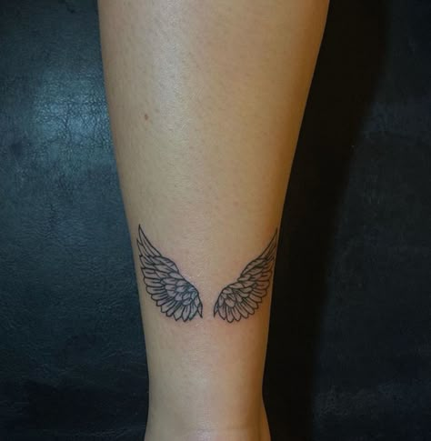 Angel Wings Tattoo On Back Of Leg, Angel Wings Tattoo On Achilles, Wing Tattoo Placement Ideas, Angel Wings Tattoo On Leg, Pretty Angel Wings Tattoo, Angel Wings On Back Tattoo For Women, Feather Angel Wings Tattoo, Two Wings Tattoo, Wrist Angel Wing Tattoo