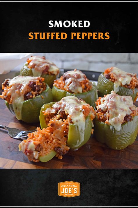 This recipe combines fresh bell and jalapeño peppers, yellow onion, pepper jack cheese, basmati rice and ground Mexican chorizo to create a layered, melty delight. Fresh Texan and Mexican flavors work together in a thick blanket of wood smoke to make these stuffed peppers a worthy main dish or an action-packed side. Stuffed Bell Peppers On The Smoker, Traeger Stuffed Peppers, Smoker Stuffed Peppers, Smoked Stuffed Bell Peppers, Smoked Bell Peppers In Smoker, Traeger Snacks, Smoked Stuffed Peppers, February Dinners, Stuffed Peppers Ground Beef