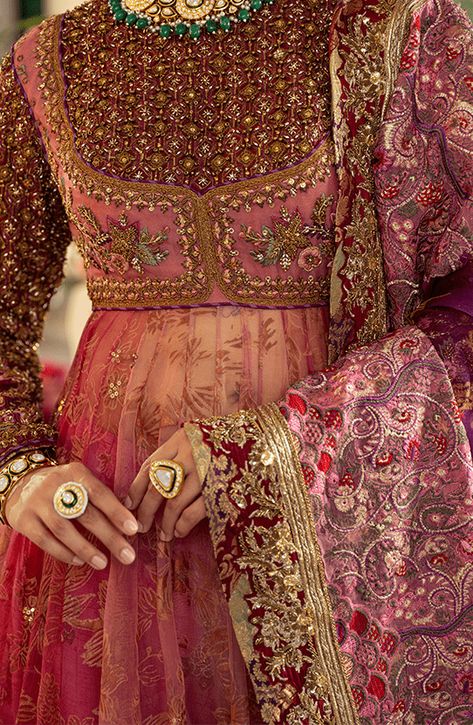 Pakistani Bridal Dress in Pishwas Frock Sharara Style is an iconic attire that has the perfect balance of traditional and glamorous look. Hand-crafted embellishments and luxury designs make this beautiful Pishwas Dress an epitome of beauty and your foremost priority. Pakistani Bridal Pishwas: Pakistani Bridal Pishwas Frock in an alluring pink shade is adorned with hand-crafted details of shimmering sequins, and motifs. Lavish floral designs and fine details of embroidery make this Pakistani Pish Gorgeous Pakistani Dresses, Pakistani Suits Bridal, Pink Bridal Pakistani, Pishwas Designs, Heavy Anarkali Dress, Floral Indian Dress, Pakistani Wedding Guest Outfits, Frock Sharara, Angharka Style Frock