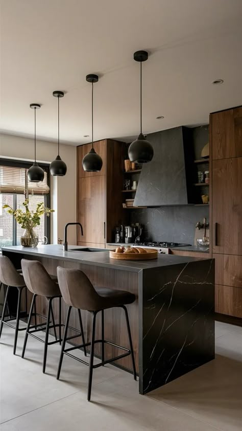 Elevate your kitchen with a striking black marble island! Discover sleek and modern design ideas that bring a touch of luxury and drama to your space. Perfect for those who love a bold, sophisticated look in the heart of their home. 🛠️ #KitchenInspiration #BlackMarble Black Quartz Island, Black Marble Kitchen Island, Black Concrete Kitchen Island, Black Quartz Waterfall Island, Brown Marble Island Kitchen, Black Island Countertop Stone, Black Marble Island, Dark Kitchen Island, Black Marble Kitchen