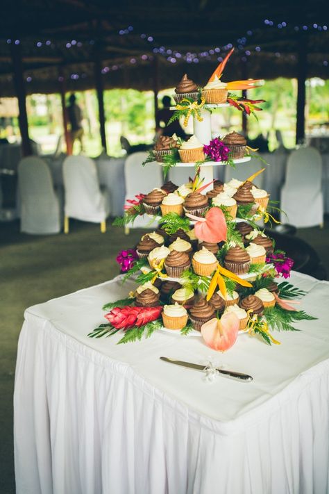 Beautiful tropical wedding cupcake stand by Taste Fiji! Tropical Wedding Cupcakes, Luau Engagement Party, Wedding Cupcake Table, Tiki Wedding, Wedding Food Display, Wedding Cupcake Display, Jamaican Wedding, Indonesian Wedding, Tropical Wedding Cake