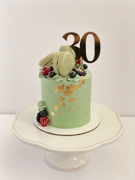 Avocado green cake with gold leaf accents. Cake is decorated with berries and green macarons. Cake topper reads “30”. Birthday Cake With Macarons, 30th Birthday Cake For Women, Macaron Cakes, Cake With Macarons, Birthday Cake For Women, Cake For Women, Green Birthday Cakes, Macaroon Cake, 30th Birthday Cake