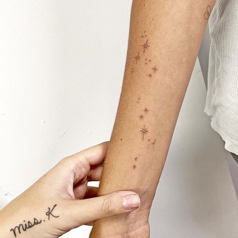 Scorpio Zodiac Star Tattoo, Stars On The Shoulder Tattoo, Sparkles Arm Tattoo, Freckles Star Tattoo, Star Tattoos Forearm, Arm Stars Tattoo, Twinkly Star Tattoo, Constellation Wrap Around Tattoo, Sparkle Tattoo Forearm