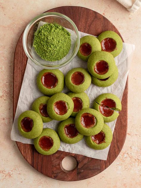 A wooden board with vegan matcha thumbprint cookies laid out on top. Matcha Thumbprint Cookies, Vegan Matcha Cookies, Matcha Vegan, Christmas Cafe, Matcha Cookies, Best Matcha, Crinkle Cookies, Food Scale, Fruit Jam