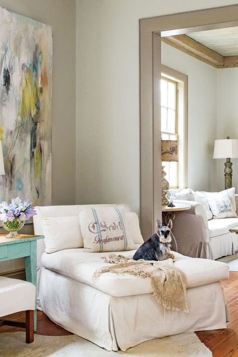 Taupe is fan favorites for walls, trim, cabinets, and more—especially where a little cottage charm is needed. Here are a few of our favorite spaces that call on this warm and cozy neutral, plus the best taupe paint colors to help you get the look.  #taupepaintcolors #taupe #livingroom #ideas #southernliving White Wall With Taupe Trim, Taupe Interior Trim, Taupe Molding White Walls, Cream Walls Taupe Trim, White Walls With Taupe Trim, Tan Interior Paint Colors, White Walls Taupe Trim, Dark Taupe Living Room, Taupe Trim White Walls