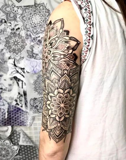 Looking for a lotus mandala tattoo design? Take a look at this tattoo from one of the best artists on Instagram doing mandala right now. Tap on the photo to find out more about the history of the lotus mandala design, and how it transitioned from a buddhist symbol into a beloved tattoo design. #tattoostylist #tattoos #mandalatattoo #tattooideas Mandala Faded Tattoo, Madella And Flower Tattoo, Buddhist Mandala Tattoo, Layered Mandala Tattoo, Mandala Tattoo Meaning Symbols, Mandala Tattoo With Flowers, Mandala Half Sleeve Tattoo For Women, Colour Mandala Tattoo, Mandala And Flower Tattoo