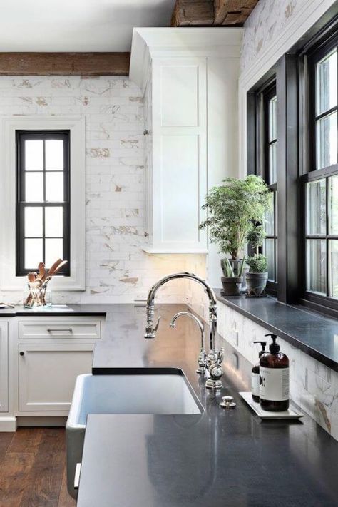 Instead of a minimal backsplash, the new kitchen and bath models showcase floor-to-ceiling paneling. Homes With Wrap Around Porches, Boston House, Home Bunch, Black Countertops, Kitchen Backsplash Designs, This Old House, White Kitchen Design, Classic Home, Kitchen Tiles Backsplash