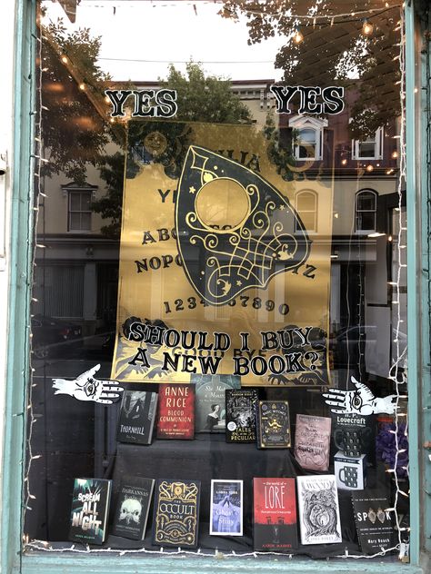 Witchy Bookstore Aesthetic, Bookshop Ideas Design, Gothic Bookstore Aesthetic, Bookstore Pop Up Booth, Window Display Bookstore, Coffee Shop Bookstore Design, Halloween Bookstore Displays, Witchy Pop Up Shop, Bookstore Window Display Ideas