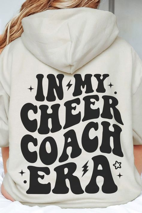 in my cheer coach era hoodie Cheer Coach Ideas, Cheer Mom And Coach Shirts, Cheer Coach Shirts Design, Cheer Coach Outfit, Cheer Coach, In My Cheer Coach Era, Cheerleading Coach Shirts, Cheer Coach Hoodie, Cheer Coach Shirts