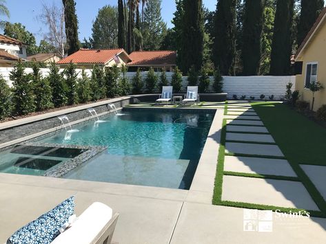 This modern styled backyard remodel located in Westlake Village, CA features a rectangular pool with a spa and Baja shelf, and a +18” premier stacked stone face raised bond beam with three 18” sheer descents. Modern Pool And Spa, Baja Shelf, Square Pool, Rectangle Pool, Pools Backyard Inground, Luxury Swimming Pools, Pool Remodel, Rectangular Pool, Gunite Pool