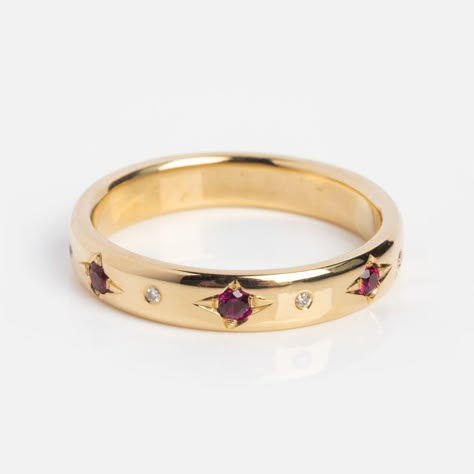 Add a pop of color to your timeless style with the Ruby and Diamond Eternity Band by Scosha. This band stands out on its own or would colorfully complement many engagement rings. Ruby 1.4 x 1.7 mm Diamond 1 mm 14k solid yellow gold Band width 3.5 mm Ruby And Tanzanite Ring, Engagement Ring Diamond And Ruby, Silver And Ruby Ring, Cuff Ring Wedding Band, Ruby And Diamond Ring Band, Ruby And Sapphire Rings, Wedding Band With Colored Stones, Garnet Eternity Band, Flat Rings Engagement