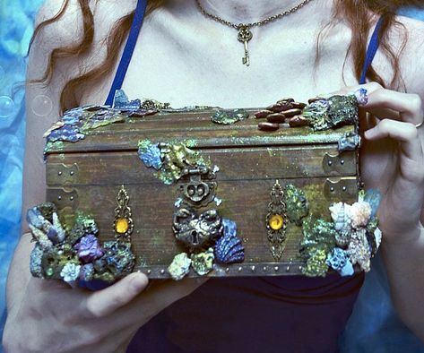 Turn your undervalued jewelry collection into priceless treasure by storing in the mermaid treasure chest. This custom chest provides ample storage space and comes decorated with intricate nautically themed details like vivid coral and a crab shaped lock. Mermaid Treasure Chest, Mermaid Treasure, Chest Ideas, Old Wooden Boxes, Mermaid Crafts, Mermaid Room, Mako Mermaids, Diy Tops, Magic Aesthetic