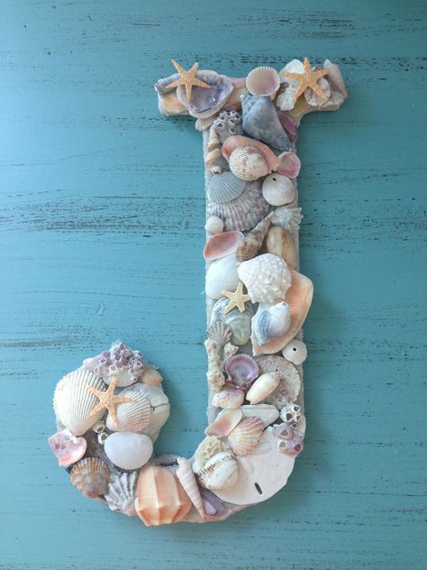 DYI Sea shell letter! This is a great craft for all the fun treasures you find on the beach! All you need is a wooden letter of any size or shape, sand (I covered the whole letter in sand and mod podge first so it shows through the little gaps and adds texture), sea shells, and E600! Just cover, arrange, and create! Such a fun craft to do especially with friends and family! :D Ocean-inspired Shell As Summer Gift, Seashell Name Sign, Unique Handmade Shell For Beach Decor, Letters With Seashells, Seashell Letter, Army Crafts, Handmade Ocean-inspired Shell For Beach Season, Seashell Art Diy, Letter Decor