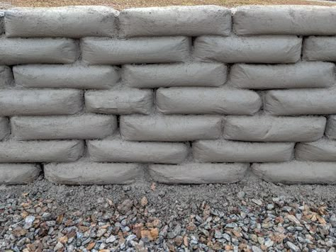 Concrete Bag Retaining Wall, Diy Retaining Wall, Backyard Retaining Walls, Concrete Bags, Building A Retaining Wall, Earth Bag Homes, Bag Wall, Concrete Retaining Walls, Types Of Concrete