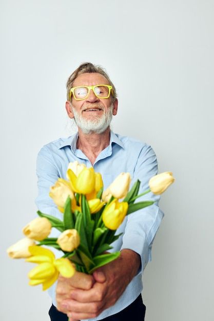 Elderly man a bouquet of flowers with gl... | Premium Photo #Freepik #photo #senior-man #mature-man #elderly-man #old-man Men Flower Bouquet, Men With Flowers, Man Bouquet, Yellow Bouquets, A Bouquet Of Flowers, Gift Bouquet, Industrial Photography, Holiday Background, Light Background