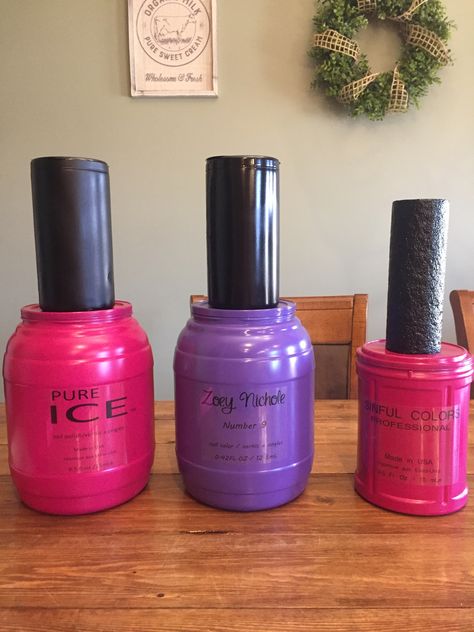 Giant nail polish for a spa party! Empty food containers, spray painted. Clear sticker paper for the label, and for the nail polish lid, for the bigger ones I used disinfect wipe containers and the small one is a bigger pool noodle, you could use styrofoam cones but they can get a bit pricey! Giant Nail Polish Bottle, Nail Polish Valentine Box Ideas, Giant Perfume Bottle Prop, Giant Makeup Props, Spa Birthday Ideas, Diy Party Props, Makeup Party Decorations, Beauty Party Ideas, Makeup Birthday Party