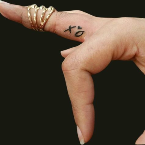 25 Adorable XO Tattoos To Spread Love And Affection Xo Logo Design, He Would Love First Tattoo, Xo Tattoo The Weeknd, Ovo Tattoo, Y Tattoo, Xoxo Tattoo, The Weeknd Tattoo, Xo Tattoo, Smiley Face Tattoo