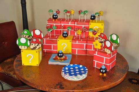 Mario Brothers dessert table with cake pops and cookies Super Mario Brothers Cake, Mario Brothers Cake, Cake Pop Stand, Mario Bros Cake, Super Mario Cake, Mario Cake, Cake Pop Stands, Super Mario Brothers, Mario Bros.