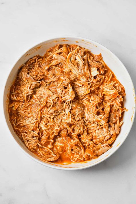 This authentic chicken tinga recipe is made with shredded chicken that's been simmered in a rich tomato sauce. Chipotle peppers give the sauce its smoky flavor and Mexican charm. Chicken Tinga Chopt Copycat, How To Make Tinga De Pollo, Authentic Chicken Tinga Recipe, Authentic Chicken Tinga, Shredded Chipotle Chicken, Tinga Chicken, Steak Rub Recipe, Tinga Recipe, Chicken Tinga Recipe