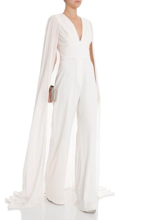 Elie Saab Bklss Jumpsuit W Train  - Deep v neckline and banded waistband  - Cut out back with sheer cape design  - Concealed side zip fastening  Styled with: Alaia shoes, Kotur clutch Cape Pantsuit, Pantsuit With Cape, Wedding Pantsuit With Cape, Jumpsuit Bride, Wedding Jumpsuit With Cape, Jumpsuit Cape, Jumpsuit With Cape, Bridal Pantsuit Brides, Black Bridal Jumpsuit With Cape