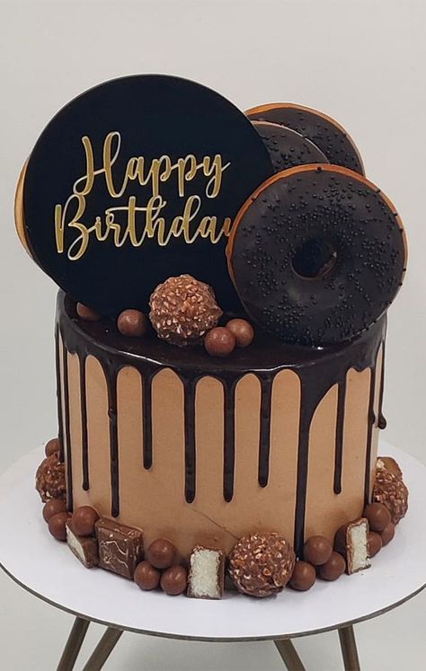 chocolate cake, chocolate birthday cake, birthday cake images, birthday cake ideas 2021 Chocolate Cake Happy Birthday, Chocolate Cake For Boy, Birthday Cake With Donuts On Top, Doughnut Cake Ideas, Cake Designs With Chocolate, Donuts Cake Birthday, Chocolate Cake Decorating Ideas Birthday, Tart Cake Birthday, Donut Cake Birthday