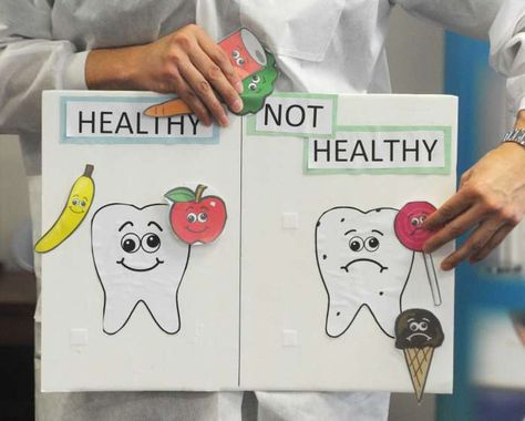 Dental Hygienist Steve Rodriguez shows health and unhealthy foods during Grauer Preschool dental education day at Family Centers in Greenwich, Conn. Wednesday, Feb. 22, 2017. The Family Centers dental team gave a brushing and flossing demonstration to youngsters with fun activities like large model tooth-brushing, flossing Play Doh "cavities" and picking good and bad foods for teeth. Photo: Tyler Sizemore / Hearst Connecticut Media / Greenwich Time Healthy And Unhealthy Food Activities For Preschool, Dental Presentation For Kids, Bahamas Activities, Healthy And Unhealthy Food Activities, Teeth Photo, Dental Education, Healthy And Unhealthy Food, Tooth Brushing, Dental Health Month