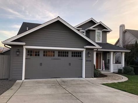 What Color Garage Door Goes with a Gray House? (14 Ideas) 18 Wood Garage Doors Dark Gray House, Garage Same Color As House, Grey House Garage Door Color, Peppercorn Sherwin Williams Garage Door, White House With Gray Garage Door, What Color Should I Paint My Garage Door, Garage Doors Colors, Garage Door Colors With Gray House, Dark Gray Garage Door