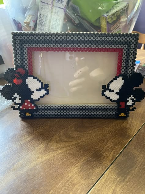 Mickey & Minnie Mouse photo frame. Follow Ig:@marias_treasure_beads Hama Bead Frame, Perler Bead Frame, Mickey Mouse Perler Beads, Disney Picture Frames Diy, Perler Picture Frame, Perler Bead Picture Frame Pattern, Perler Bead Polaroid Frame, Perler Bead Picture Frames, Picture Frame Perler Beads