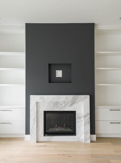 Square Fireplace Modern, Black And Marble Fireplace, Modern Wood Burning Fireplace Ideas, Black Fireplace Feature Wall, Black Stone Fireplace Surround, Modern Wall Fireplace, Black Quartz Fireplace Surround, Marble Fireplace Ideas Modern, Marble Surround Fireplace