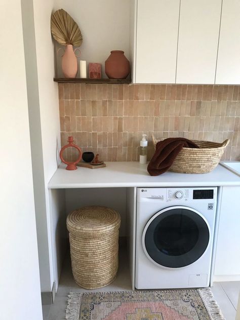 We adore the styling of this functional yet beautiful modern Mediterranean laundry. The woven laundry hamper and laundry basket work perfectly with the incredible blush pink handmade Moroccan Bejmat tile splashback. A small timber shelf adds space to style up with a few vases and vessels. Finished with a small pink rug, it's the ultimate laundry in our minds! Click the image to explore the full space. Mediterranean Laundry, Laundry Splashback Tiles, Pink Backsplash, Dog Bedroom, Coast House, Timber Shelves, Tile Splashback, Modern Mediterranean, Laundry Bathroom