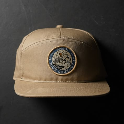 It’s like a badge you would’ve gotten in Boy Scouts but for adults. And also way cooler looking. This 5-panel hat features our badge which showcases every environment that your journey could lead. “Enjoy Your Journey” is our daily reminder to stop and appreciate the little things. We are all on our own journey, make sure to enjoy yours! Visual Clothing, Graphic Shirt Design, Hat Patch, Best Caps, 5 Panel Hat, Camo Hats, Hat Patches, Hat Ideas, Fashion Photography Inspiration