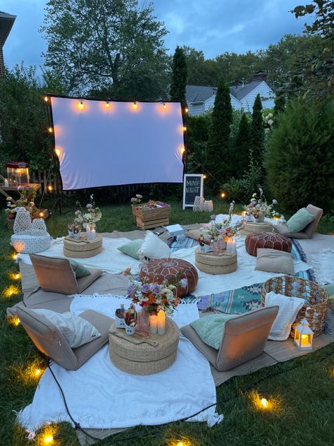 Warm tone movie night in the backyard with projecter and big screen. Backyard Movie Night Party, Movie Night Birthday Party, Backyard Birthday, Backyard Movie Nights, Backyard Movie, Movie Night Party, Sleepover Things To Do, Outdoor Movie, Backyard Party