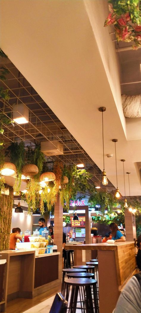 Art ideas decorations Plants Store, Coffee Shop Lighting, Hanging Light Bulbs, Coffee Shop Interior Design, Open Ceiling, Color Lights, Coffee Shops Interior, Cafe Lights, Cozy Cafe