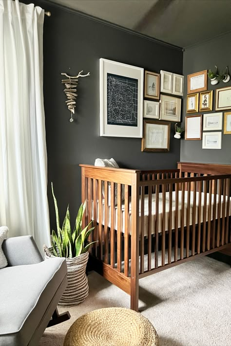 Charcoal Nursery Walls, White Gray And Brown Nursery, Gender Neutral Moody Nursery, Urbane Bronze Nursery, Nursery Dark Walls, Dark Cozy Nursery, Dark Accent Wall Nursery, Brown And Grey Nursery, Dark Wall Nursery