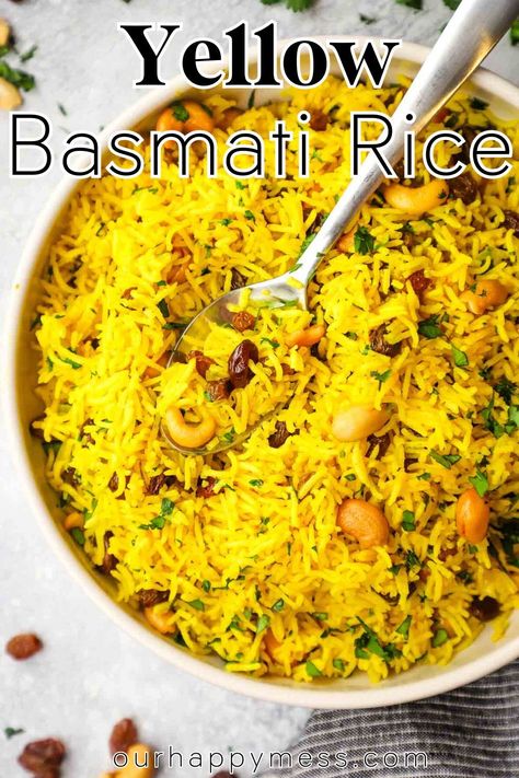 This fragrant and flavorful yellow basmati rice is studded with plump sweet raisins and roasted cashews for a a beautiful side dish for all your curries, kabobs, and so much more. Rice With Nuts And Raisins, Basmati Yellow Rice Recipe, Yellow Rice With Raisins, Yellow Basmati Rice, Indian Yellow Rice, Indian Sides, Saffron Rice Recipe, Yellow Rice Recipes, Basmati Rice Recipes