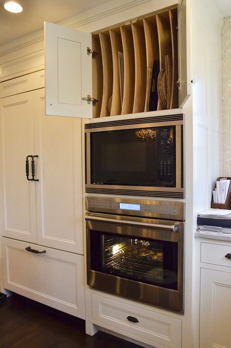 Stunning shaker kitchen features cabinet front fridge with freezer drawers alongside a stainless steel wall oven under an integrated microwave and custom baking cabinet above filled with vertical tray shelves. Serveware Storage, Kitchen New York, Cookie Sheets, Kitchen Hacks Organization, Shaker Kitchen, Kitchen Redo, Trendy Kitchen, Traditional Kitchen, Kitchen Remodel Idea