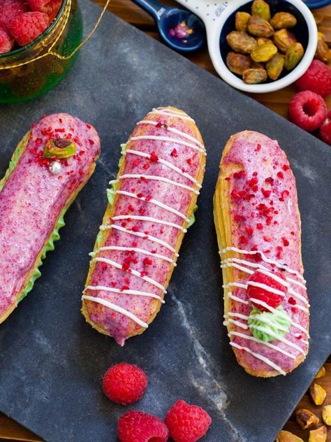 Eclair Recipe Videos, Raspberry Eclairs, Eclair Dessert, Choux Dough, Raspberry Pistachio, Eclair Recipe, Pistachio Cream, Dried Raspberries, Pastry Desserts