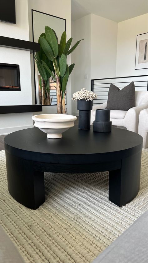 Gray Sofa Black Coffee Table, Black And White Coffee Table Decor, Cream Couch Black Coffee Table, Natural And Black Living Room, Round Coffee Table Black, Living Room With Black Coffee Table, White And Black Living Room Ideas, Black Coffee Table Styling, Round Coffee Table Styling Ideas