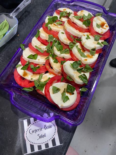 Caprese salad used for ‘Corprese Bride Salad’ as a hint to ‘The Corpse Bride’. #timburtonparty #timburton #partyideas #partyfood #party #partyfoodideas #themedparty #themedpartyfood #corpsebride #tomatodish #capresesalad Corpse Bride Party Food, Corpse Bride Themed Food, Corpse Bride Dinner And Movie, Corpse Bride Movie Night, Corpse Bride Food Ideas, Tim Burton Themed Party Food, Tim Burton Food Ideas, Corpse Bride Party Decorations, Corpse Bride Food