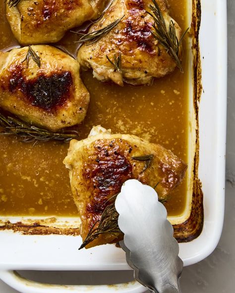 overhead shot of someone taking out a single maple dijon chicken thigh from the baking dish with tongs Maple Dijon Chicken Thighs, Maple Chicken Thighs, Maple Syrup Chicken, Dijon Chicken Thighs, Maple Dijon Chicken, Glazed Chicken Thighs, Easy Baked Chicken Thighs, Maple Glazed Chicken, Maple Chicken