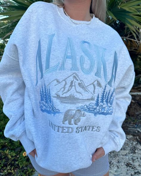 Our new Alaska graphic sweatshirts are going quick! Swipe to see it on! 🐻🌲🏔️ // $69.50 Cute Sweatshirts, Clothing Logo, Logo Collection, Pearl Grey, Embroidered Sweatshirts, Cute Fits, Sweater Accessories, Christmas Shopping, Unisex Fashion