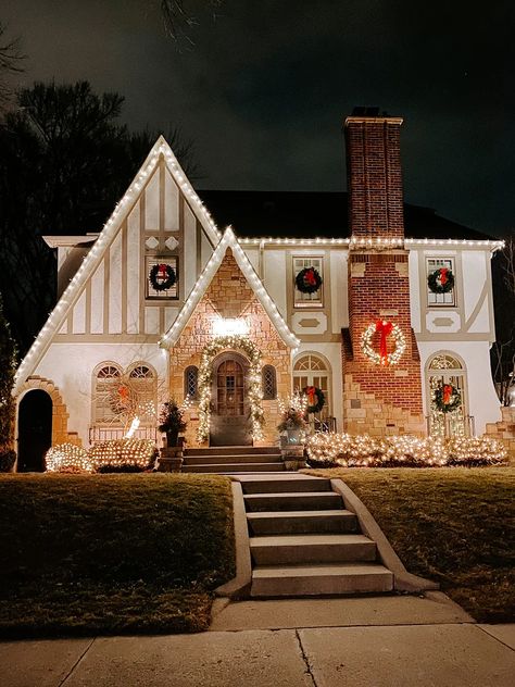 Christmas lights outside brighten up this home for the holidays Exterior Christmas Lights, Christmas Exterior, Storybook House, Fresh Garlands, Hawthorne House, Christmas Lights Outside, Lights Outside, Christmas Lights Ideas, Window Wreath