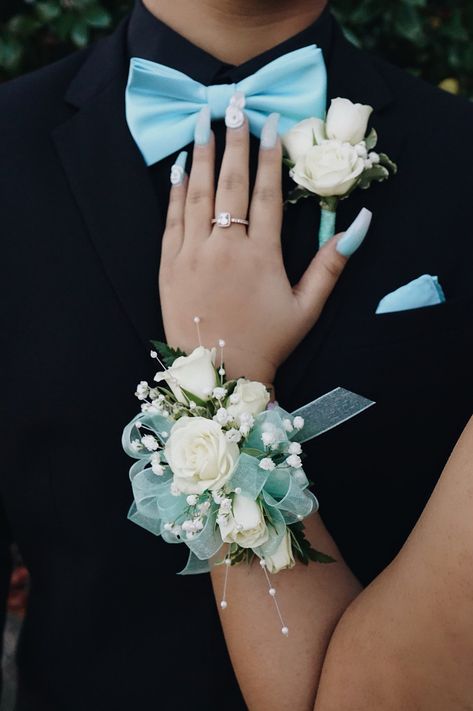 Light Blue And White Corsage And Boutonniere, Mint Green Corsage And Boutonniere, Prom Flowers For Iridescent Dress, Corsage And Boutonniere Ideas, White And Teal Corsage, Blue Corsage Homecoming, Corsage For Teal Dress, Corsage And Boutonniere Set Prom, Baby Blue Corsage And Boutonniere