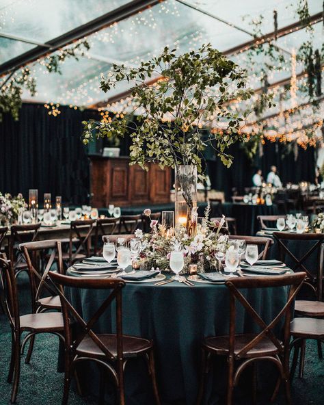 A Moody, Gothic-Inspired Wedding in a Vermont Birch Grove #WeddingInspiration #TableDecor #WeddingPlanning #Weddings | Martha Stewart Weddings Black And Green Reception Decor, Candlelight Wedding Reception Centerpiece Ideas, Dark Green Moody Wedding, Green Moody Wedding, Moody Gothic Wedding, Gothic Wedding Reception, Moody Green Wedding, Black Green Wedding, Round Centerpieces Wedding