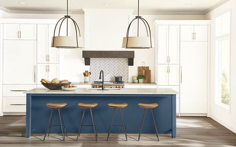 Add character to any kitchen with just two or three paint colors. The right color combinations can make an island pop, highlight the architectural details of cabinets or turn walls into an elegant backdrop. Love this combo? The island is painted in Sherwin-Williams Naval SW 6244, the cabinets are Pure White SW 7005, and the walls are Roman Column SW 7562. #kitchen #kitchenpaint #cabinetcolors #sherwinwilliams #colorinspiration Houseboat Ideas, Coloured Kitchen, Coastal Kitchens, Kitchen Cabinets Color Combination, Latest Kitchen Trends, Kitchen Colour Combination, Top Paint Colors, House Renos, Remodeling Trends